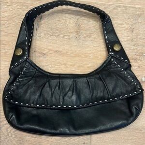 BCBGMaxAzria Black Shoulder Bag with Chic Crescent Shape and Bronze Studs